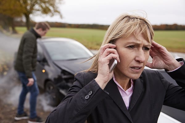 Woman Calling Car Accident Lawyer After Being Hit by an Uninsured Driver