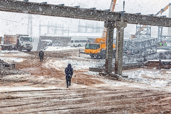 A construction site during a snowstorm